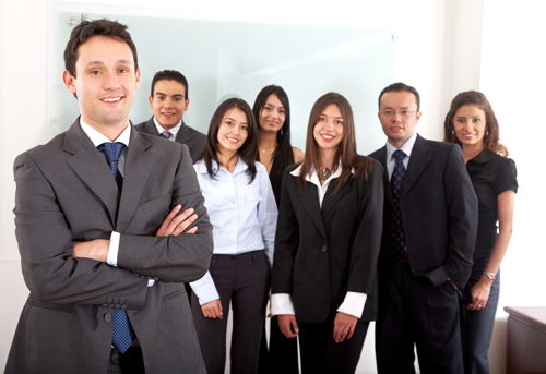 Human resources coordinator standing in front of happy staff