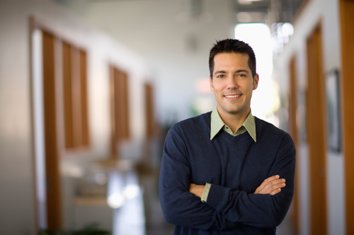 Consultant standing with his arms crossed